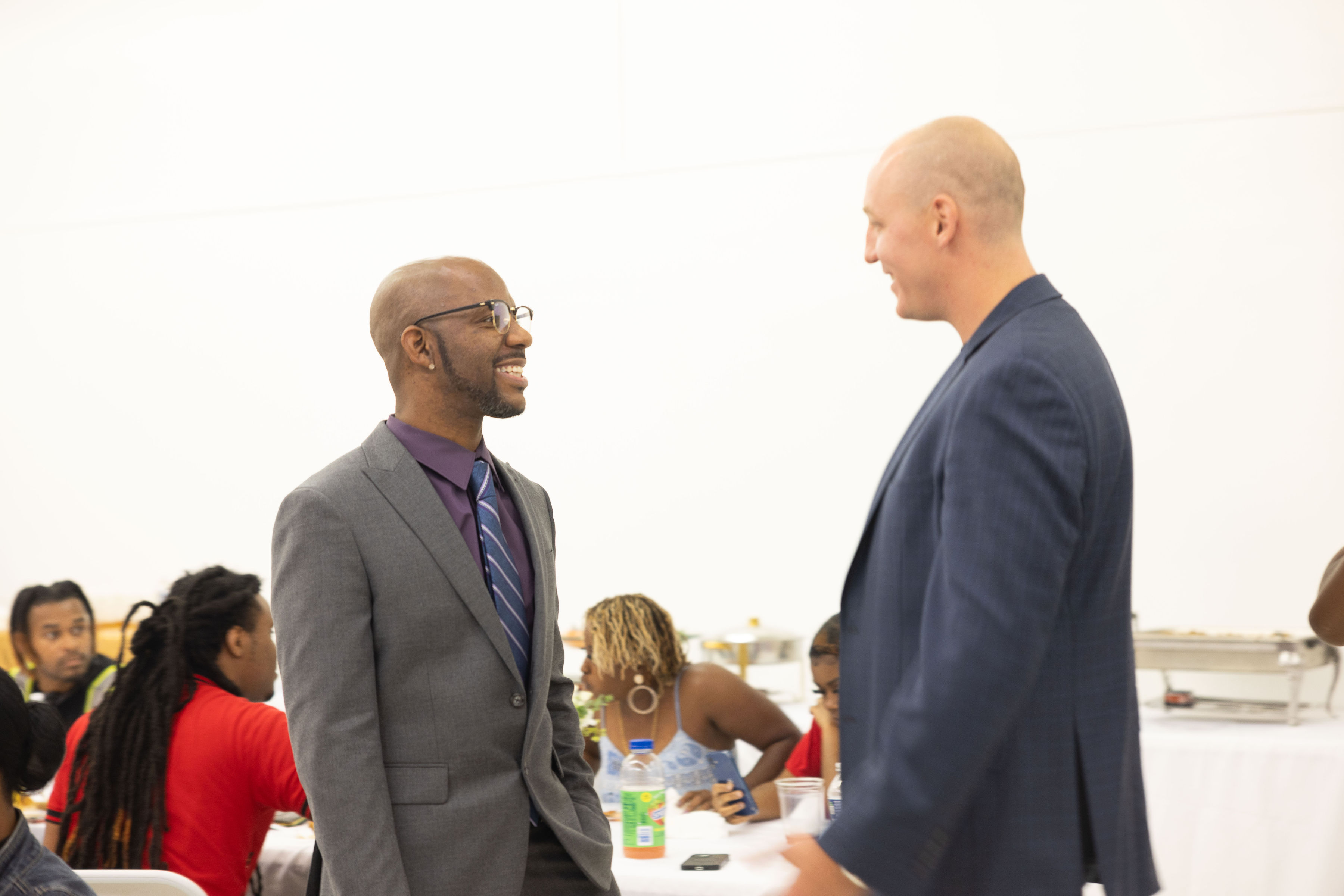 William Wade greeting a guest at a live W.A.D.E. room